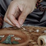 Self-Healing Materials - Person Making Bracelets With Beads