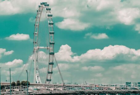 Flywheels - white and gray bridge under cloudy sky during daytime