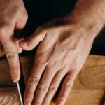 Methods - Person Holding Silver Bread Knife