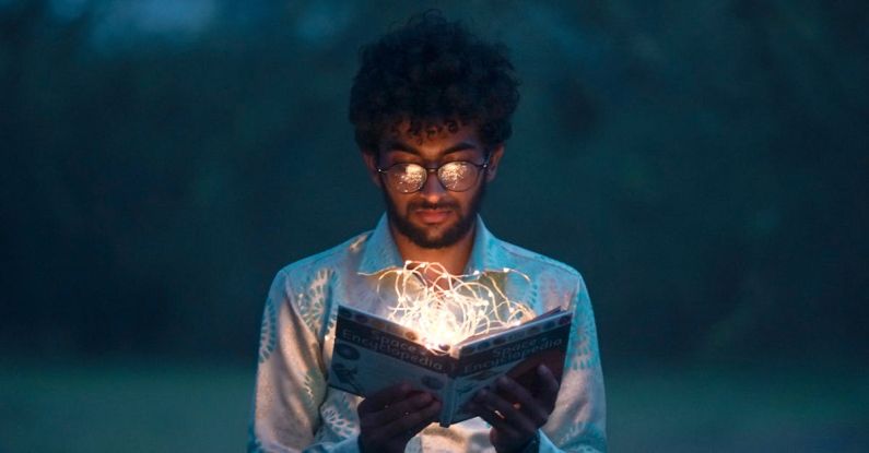 Knowledge - Man Holding Book