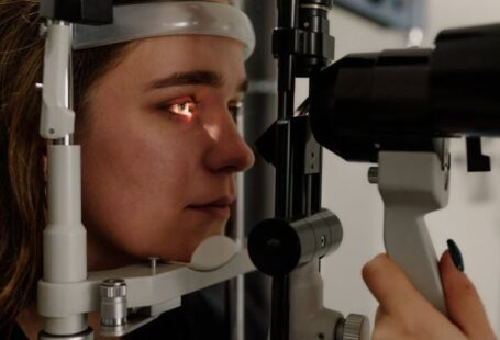 Machine Vision - Woman testing vision on microscope