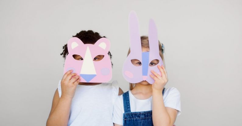 Innovative Techniques - Two Kids Covering Their Faces With a Cutout Animal Mask