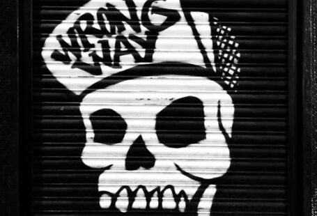Quick Fixes - Funky skull graffiti on locked roll down black door