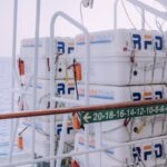 Safety Protocols - A large white container on the deck of a ship