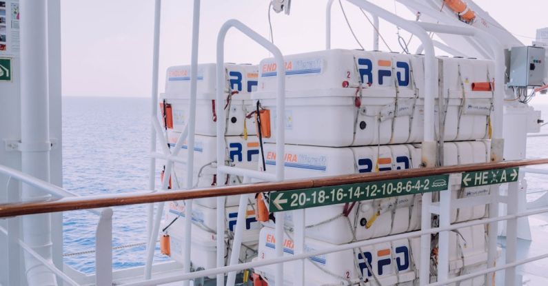 Safety Protocols - A large white container on the deck of a ship